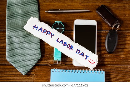 Happy Labor Day Business Background Concept, Smart Phone, Watch, Necktie, Car Key On Wooden Background With Happy Labor Day Text