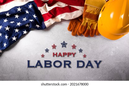 Happy Labor day concept. American flag with different construction tools on dark stone background. - Shutterstock ID 2021678000