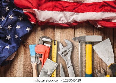 Happy Labor day. Construction tools. Copy space for text on wood background. - Shutterstock ID 1228045429