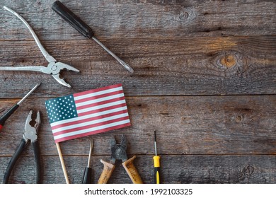Happy Labor day. Construction tools and the USA America flag . Copy space for text on wood background. - Shutterstock ID 1992103325