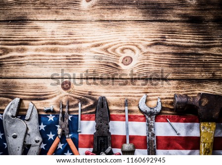 Happy Labor day. Construction tools. Copy space for text on wood background.