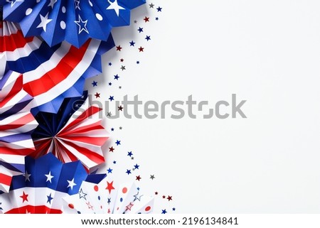 Happy Labor Day, Independence Day, Veterans day banner design. Flat lay red, white, and blue USA paper fans isolated on white background.