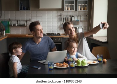 Happy Large Family At Breakfast Taking Selfie, Photographing On Phone, Having Breakfast Together On Kitchen, Smiling Children, Mom And Dad Posing For Family Photo At Home