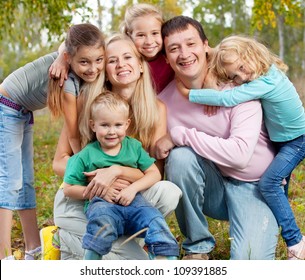 Happy Large Family With Children In Autumn Park