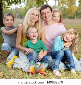 Happy Large Family With Children In Autumn Park