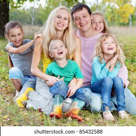 Happy Large Family With Children In Autumn Park