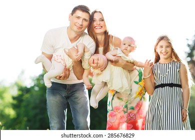 Happy Large Family With Children In The Park