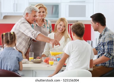 Happy Large Family On Kitchen