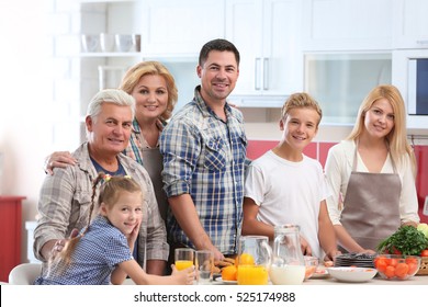 Happy Large Family On Kitchen