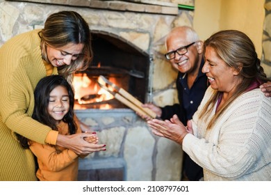 Happy Latin Family Cooking Together On Wood Bbq Fireplace - Focus On Grandmother Face