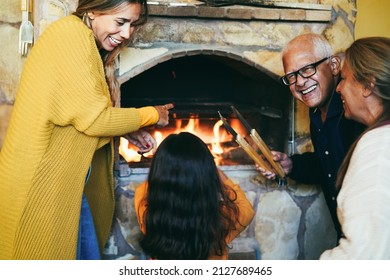 Happy Latin Family Cooking Together On Wood Bbq Fireplace - Focus On Grandfather