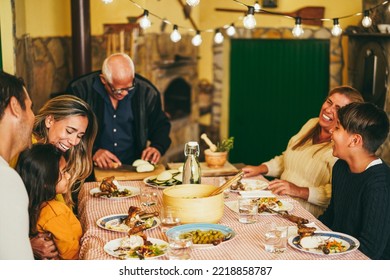 Happy Latin Family Cooking Together During Dinner Time At Home - Focus On Mother Face