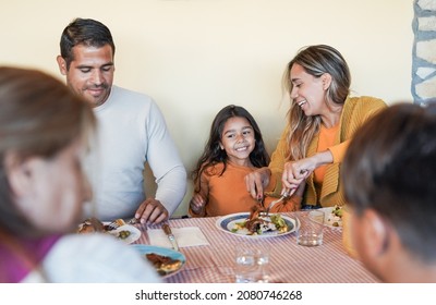 Happy Latin Family Eating Lunch Together At Home Terrace Outdoor - Focus On Cute Little Girl Smiling