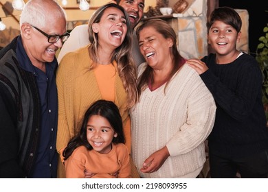 Happy Latin Family Laughing Together At Home Patio - Soft Focus On The Grandmother Face