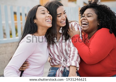 Happy latin girls enjoy time together outdoor around city - Friendship and diverse ethnicity concept - Main focus on black woman face ストックフォト © 