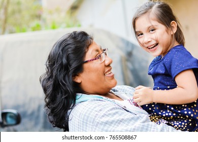 Happy latin mom and little daughter outside. - Shutterstock ID 765508867