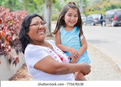 Happy Latin Mom And Little Daughter Outside. 