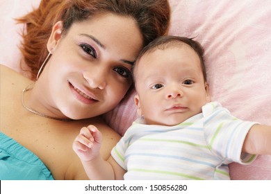 Happy Latin Mother With Her Baby