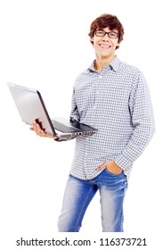 Happy Latin Teenager In Black Glasses Holding Laptop In One Hand. Isolated On White Background, Mask Included