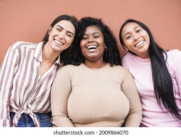 Happy latin women with different skin color looking in camera - Concept of multiracial people, friendship and happiness