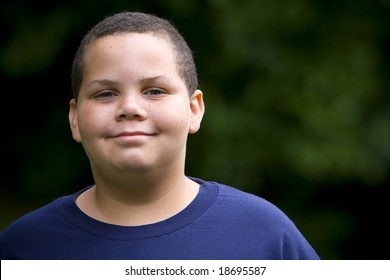 Happy latino boy close-up portrait outdoors