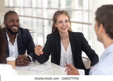 Happy Laughing Black Man And Woman Break In Business Negotiations. Fun Smiling African American Businessman And White Businesswoman At Meeting With Partner And Investors, Female And Male Relationship