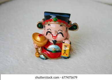Happy, Laughing Chinese God Of Good Fortune In Money And Finance Figurine. 