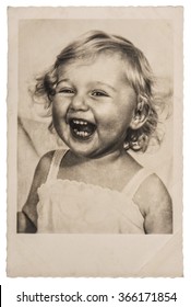 Happy Laughing Little Baby Girl. Vintage picture with original film grain and blur