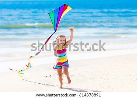 Similar – Image, Stock Photo Flying rainbow kites coast