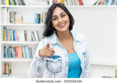 Happy Laughing Mature Adult Hispanic Woman Indoors At Home