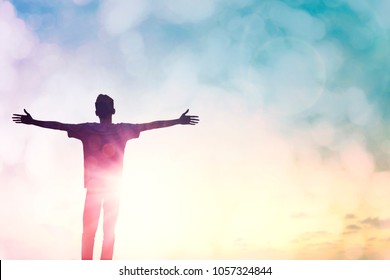 Happy leader man rise hand on morning sun light view. Christian motivation inspiration confide God on good friday background concept for feel self confidence successful healed wellbeing, dream like.
