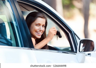 happy learner driver young girl smiling portrait with car keys