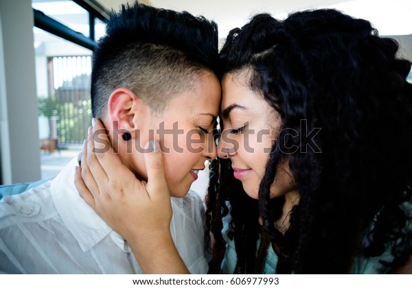 Happy Lesbian Couple Embracing Each Other Stok Fotoğrafı 606977993