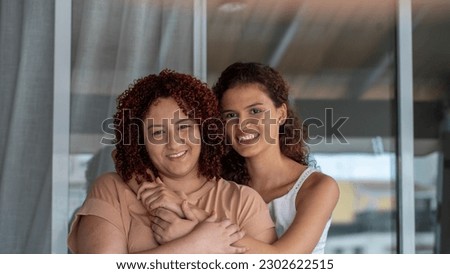 Similar – Happy women looking at camera over garden fence