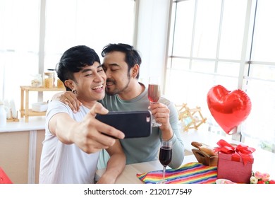 Happy LGBT Couple Share Special Moment Together On Valentine Day, Asian Gay Male Lover Take Selfie While Hug And Drink Champagne Celebrate Memorable Anniversary, Unforgettable Romantic Dating Dinner