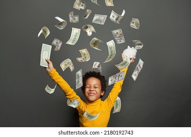 Happy Little African American Kid Boy Under Us Dollar Money Rain On Black Background