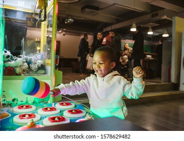 A happy little African boy is playing fun games. Children's happiness is the greatest - Powered by Shutterstock - Get 15% off with code: PIKWIZARD15