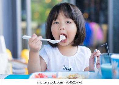 Happy Little Asian Girl Use Fork Stock Photo 704525776 