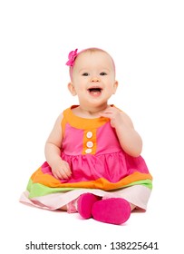 Happy Little Baby Girl In Bright Multicolored Festive Dress Isolated On A White Background