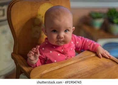 Happy Little Baby Girl In Vintage Wood High Chair At Grandma's House