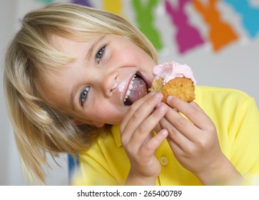 Happy little boy eat cupcake - Powered by Shutterstock