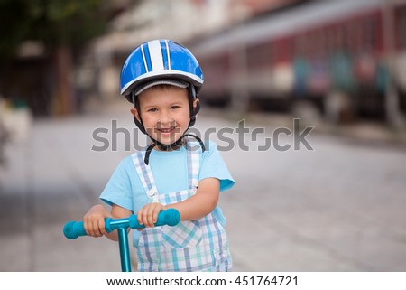 Similar – A funny boy riding his bicycle