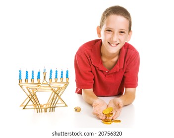 Happy Little Boy Holding Hanukkah Gelt He Won Playing Dreidel.  Isolated On White.
