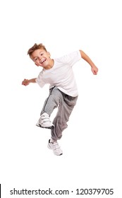 Happy little boy jumping isolated on white background