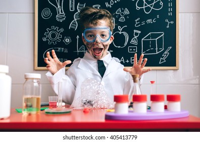 Happy little boy playing excited with experiment results - Powered by Shutterstock