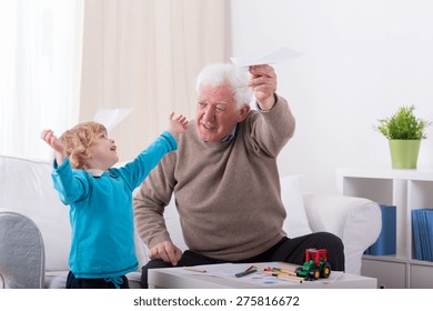 Happy little boy playing with paper airplane - Powered by Shutterstock