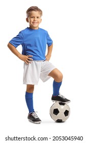 Happy Little Boy In A Sports Jersey Stepping On A Soccer Ball Isolated On White Background