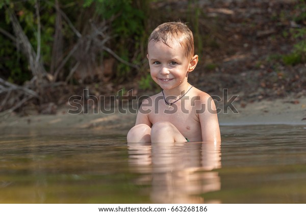 boy swimming in river