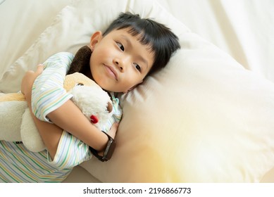 Happy Little Boy Waking Up In The Morning With Smile, Young Asian  Boy Sleeping On Bed In A Bedroom. Child Is Sleeping In The Bed. 