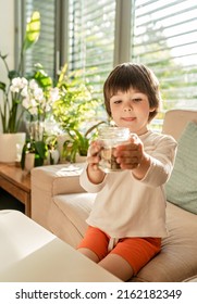 Happy Little Child Holding Glass Jar With Coins. Kid Counting Money Saving From Change Learning Financial Literacy.